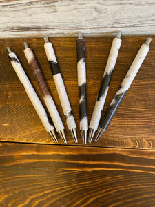 Stainless steel pens wrapped in cowhide vinyl. I have different colors to choose from. $8.00 plus shipping